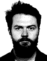 A black and white headshot of Jack Reid